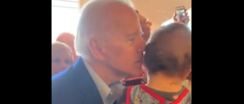 Biden sniffs baby (Twitter screengrab)