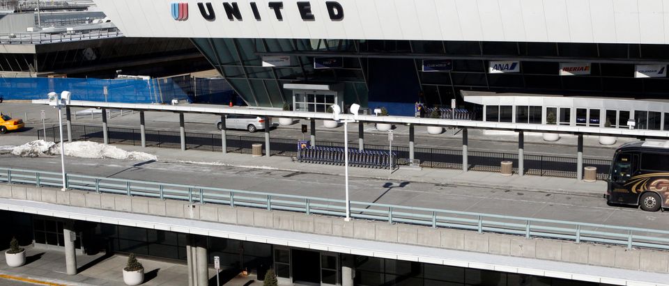 A police vehicle is parked outside a United Airlines terminal at John F. Kennedy International Airport in New York January 24, 2011. REUTERS/Jessica Rinaldi