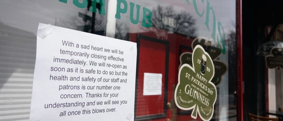 A sign outside of a pub announces its closure due to the coronavirus, COVID-19 in Washington, DC on March 16, 2020. - Stocks tumbled on March 16, 2020 despite emergency central bank measures to prop up the virus-battered global economy, as countries across Europe started the week in lockdown and major US cities shut bars and restaurants. The virus has upended society around the planet, with governments imposing restrictions rarely seen outside wartime, including the closing of borders, home quarantine orders and the scrapping of public events including major sporting fixtures. (Photo by Mandel Ngan / AFP) (Photo by MANDEL NGAN/AFP via Getty Images)