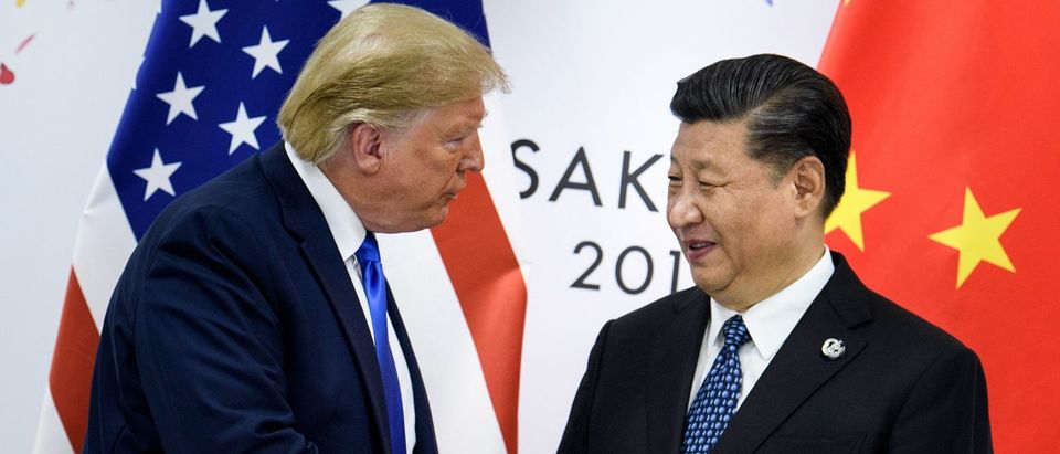 China's President Xi Jinping (R) shakes hands with US President Donald Trump before a bilateral meeting on the sidelines of the G20 Summit in Osaka. - From the Arab Spring to bloodletting in Syria, from Obama to Trump, from terror in the streets of Paris to Brexit, the 2010s began with hope for a more equitable world, and end with a slide towards nationalistic populism. (Photo by BRENDAN SMIALOWSKI/AFP via Getty Images)