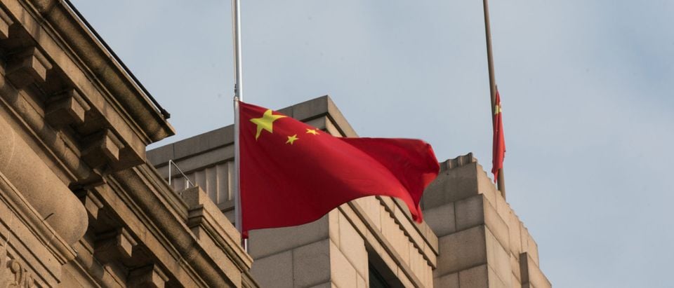The Chinese national flag flies at half-mast at the Bund to mourn victims of COVID-19 on April 04, 2020 in Shanghai, China. (Yifan Ding/Getty Images)