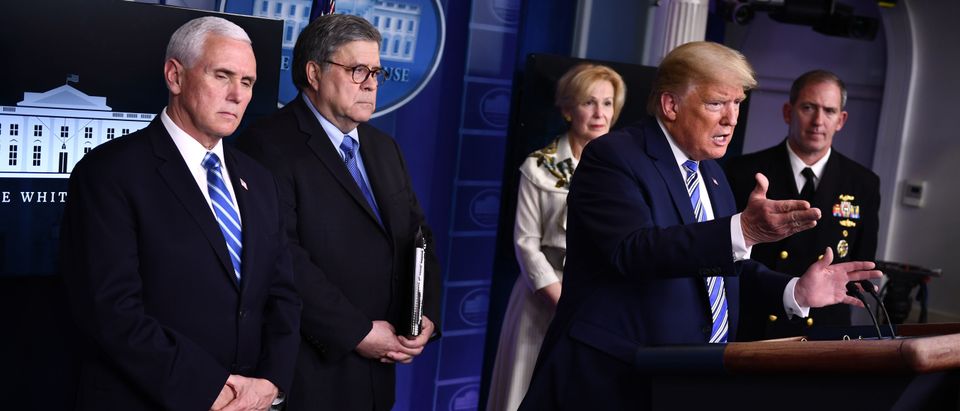 US President Donald Trump, flanked by (from L) US Vice President Mike Pence, US Attorney General William Barr, Response coordinator for White House Coronavirus Task Force Deborah Birx and Rear Admiral John Polowczyk, gestures as he speaks during the daily briefing on the novel coronavirus, COVID-19, at the White House, March 23, 2020, in Washington, DC. (Photo by BRENDAN SMIALOWSKI/AFP via Getty Images)