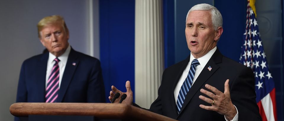 US President Donald Trump listens as US Vice President Mike Pence speaks during the daily briefing on the novel coronavirus, which causes COVID-19, in the Brady Briefing Room of the White House on April 24, 2020, in Washington, DC (Photo by OLIVIER DOULIERY/AFP via Getty Images)