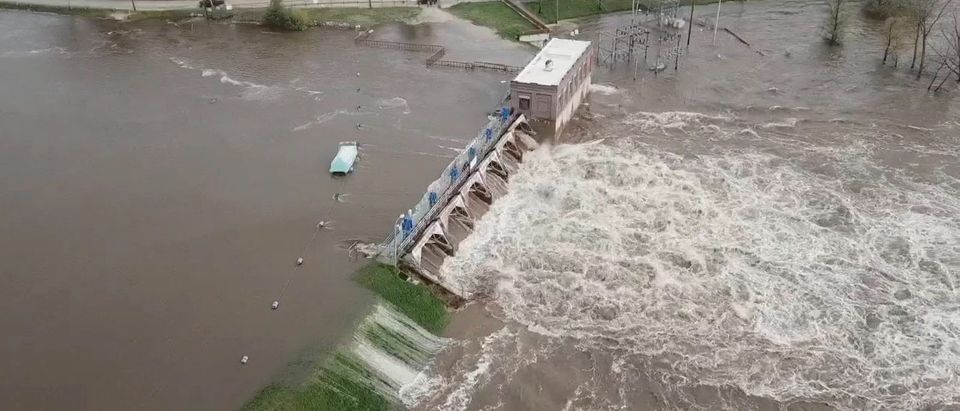 An aerial view of flooding as water overruns Sanford Dam, Michigan, U.S. in this May 19, 2020 still frame obtained from social media video