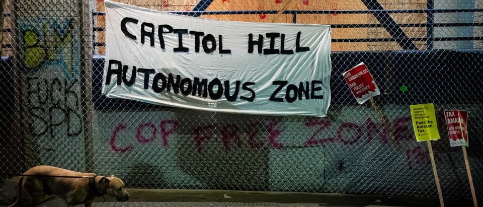 SEATTLE, WA - JUNE 09: A "Capitol Hill Autonomous Zone" sign hangs on the exterior of the Seattle Police Departments East Precinct on June 9, 2020 in Seattle, Washington. Protests have continued in many parts of the city including inside City Hall and around the Seattle Police Departments East Precinct, an area that has earned the moniker "Capitol Hill Autonomous Zone," during ongoing Black Lives Matter protests in the wake of George Floyds death. (Photo by David Ryder/Getty Images)