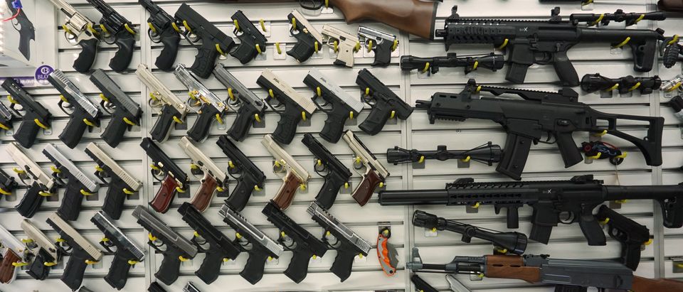 Several long guns and handguns/Shutterstock