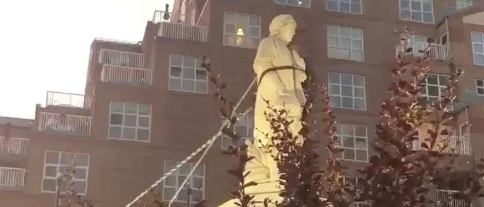 Protesters pull down the statue of Christopher Columbus in Baltimore