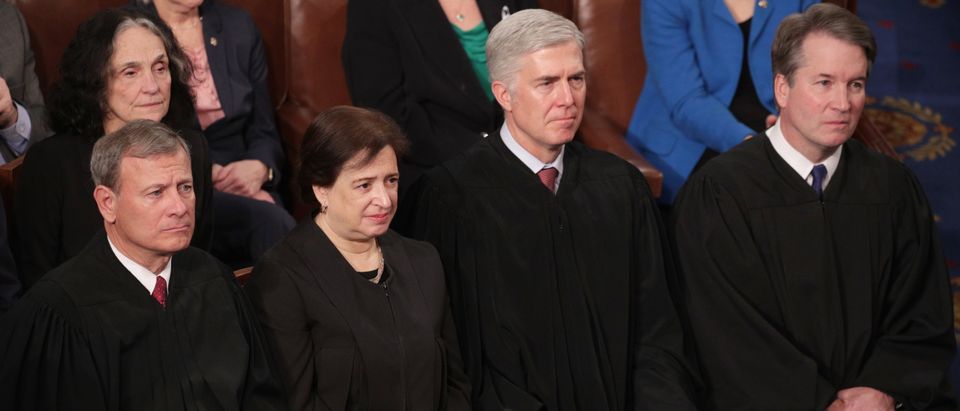 WASHINGTON, DC - FEBRUARY 05: Supreme Court Justices John Roberts, Elena Kagan, Neil Gorsuch, and Brett Kavanaugh look on as President Donald Trump delivers the State of the Union address in the chamber of the U.S. House of Representatives on February 5, 2019 in Washington, DC. President Trump's second State of the Union address was postponed one week due to the partial government shutdown. (Photo by Alex Wong/Getty Images)
