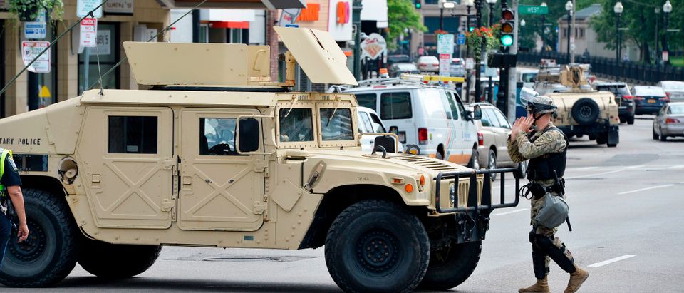 National Guard soldiers place armoured vehicles and soldiers around the city in Boston, Massachusetts on June 3, 2020. - Anti-racism protests have put several US cities under curfew to suppress rioting, following the death of George Floyd while in police custody. (Photo by Joseph Prezioso/AFP via Getty Images)