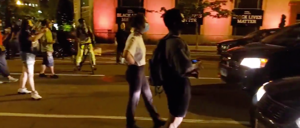 Protesters blocked off a road near BLM Plaza in DC Tuesday evening. (Screenshot Twitter, Jorge Ventura)