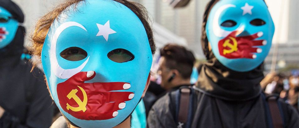 Protesters in Hong Kong stand in support of Uighur Muslims