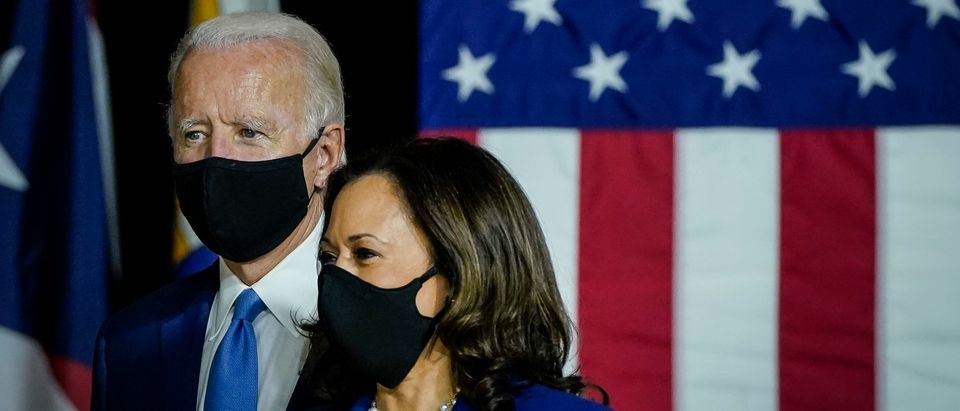Democratic presidential candidate former Vice President Joe Biden and his running mate Sen. Kamala Harris (D-CA) arrive to deliver remarks at the Alexis Dupont High School on August 12, 2020 in Wilmington, Delaware. (Drew Angerer/Getty Images)