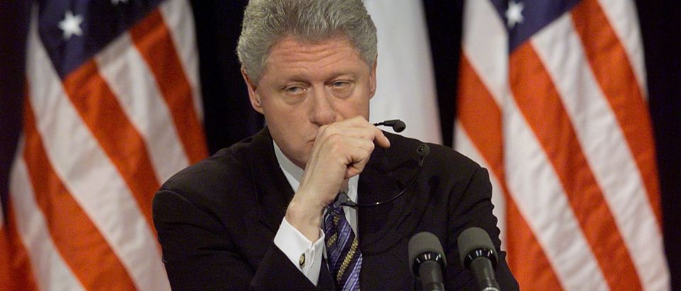 US President Bill Clinton pauses a moment while be