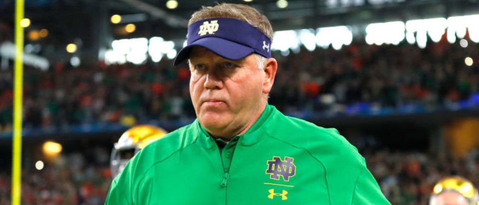 ARLINGTON, TEXAS - DECEMBER 29: Head coach Brian Kelly of the Notre Dame Fighting Irish takes the field with his team before the game against the Clemson Tigers during the College Football Playoff Semifinal Goodyear Cotton Bowl Classic at AT&amp;T Stadium on December 29, 2018 in Arlington, Texas. (Photo by Kevin C. Cox/Getty Images)