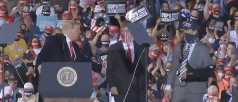 Trump brings high school students to stage (campaign TV screengrab)