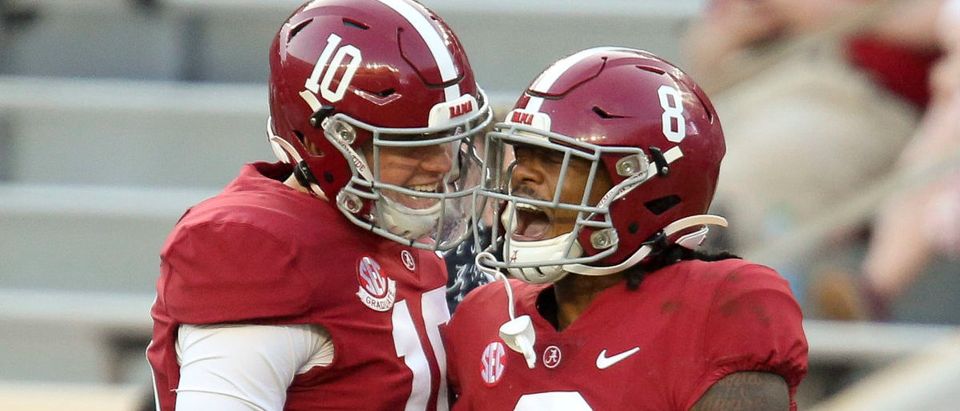 Oct 3, 2020; Tuscaloosa, Alabama, USA; Alabama quarterback Mac Jones (10) celebrates with Alabama wide receiver John Metchie III (8) after they connected for a touchdown pass against Texas A&amp;M at Bryant-Denny Stadium. Alabama defeated A&amp;M 52-24. Mandatory Credit: Gary Cosby Jr/The Tuscaloosa News via USA TODAY Sports via Reuters