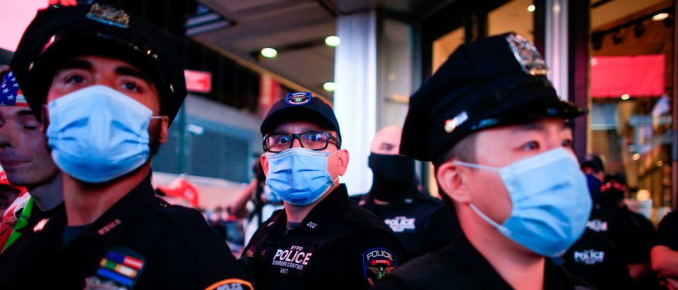 NYPD officers stand guard during a protest to demand justice for Daniel Prude, on September 3, 2020 in New York City. - Protests were planned in New York September 3 over the death of Daniel Prude, a black man that police hooded and forced face down on the road, according to video footage that prompted a probe from the state's attorney general. (KENA BETANCUR/AFP via Getty Images)