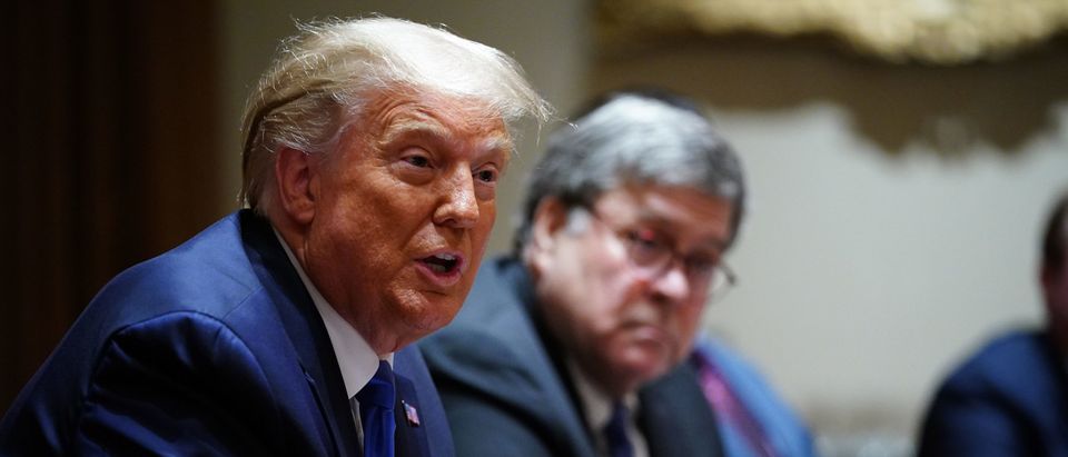 US President Donald Trump, with Attorney General William Barr (R) speaks during a discussion with state attorneys general on protection from social media abuses in the Cabinet Room of the White House in Washington, DC, on September 23, 2020. (Photo by MANDEL NGAN/AFP via Getty Images)