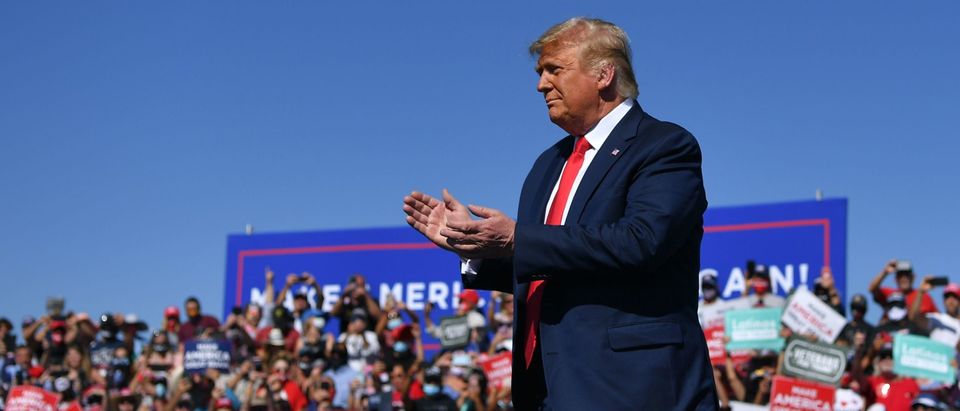 US President Donald Trump gestures on stage during a rally at Prescott Regional Airport in Prescott, Arizona on October 19, 2020. - US President Donald Trump went after top government scientist Anthony Fauci in a call with campaign staffers on October 19, 2020, suggesting the hugely respected and popular doctor was an "idiot." (Photo by MANDEL NGAN / AFP) (Photo by MANDEL NGAN/AFP via Getty Images)