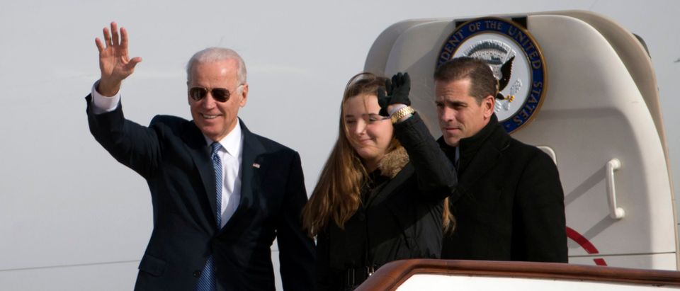 U.S. Vice President Joe Biden waves as he walks out of Air Force Two with his granddaughter Finnegan Biden (C) and son Hunter Biden (R) at the airport December 4, 2013 in Beijing, China. (Ng Han Guan-Pool/Getty Images)