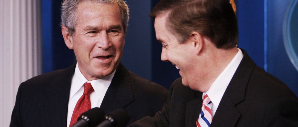 US President George W. Bush laughs with