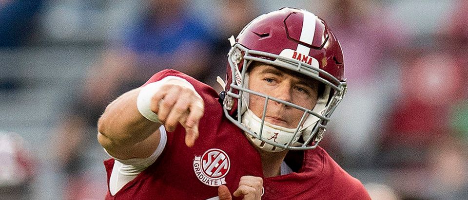 Nov 21, 2020; Tuscaloosa, Alabama, USA; Alabama Crimson Tide quarterback Mac Jones (10) throws a touchdown pass to wide receiver John Metchie III ((not pictured) against the Kentucky Wildcats at Bryant-Denny Stadium. Mandatory Credit: Mickey Welsh/The Montgomery Advertiser via USA TODAY Sports via Reuters