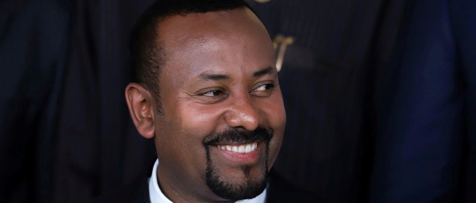FILE PHOTO: Ethiopia's Prime Minister Abiy Ahmed poses for a photograph during the opening of the 33rd Ordinary Session of the Assembly of the Heads of State and the Government of the African Union (AU) in Addis Ababa