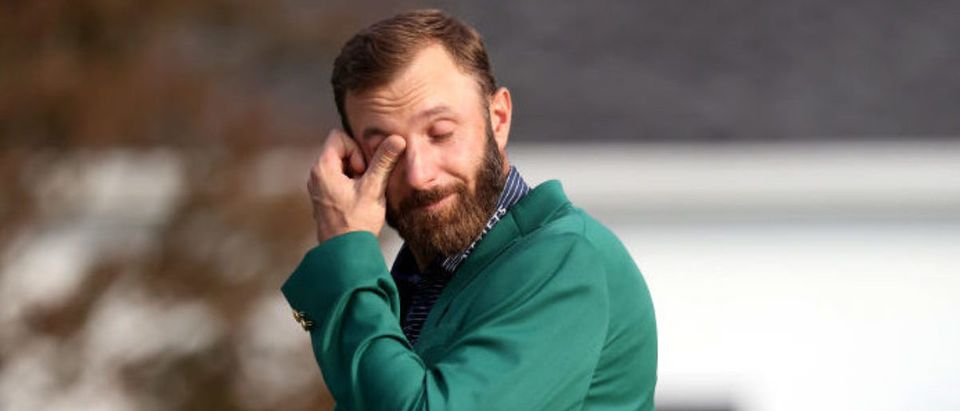 AUGUSTA, GEORGIA - NOVEMBER 15: Dustin Johnson of the United States reacts during the Green Jacket Ceremony after winning the Masters during the final round of the Masters at Augusta National Golf Club on November 15, 2020 in Augusta, Georgia. (Photo by Rob Carr/Getty Images)