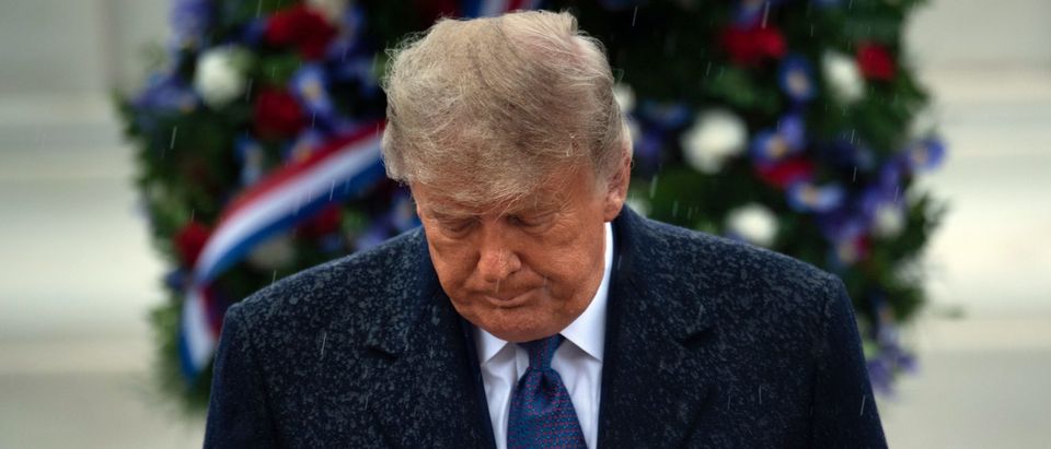 US President Donald Trump leaves after placing a wreath at the Tomb of the Unknown Soldier on Veterans Day at Arlington National Cemetery in Arlington, Virginia, on November 11, 2020. - US President Donald Trump made his first official post-election appearance Wednesday for what should be a moment of national unity to mark Veteran's Day, now marred by his refusal to acknowledge Joe Biden's win. The president visited Arlington National Cemetery, four days after US media projected his Democratic rival would take the White House. (Photo by BRENDAN SMIALOWSKI/AFP via Getty Images)