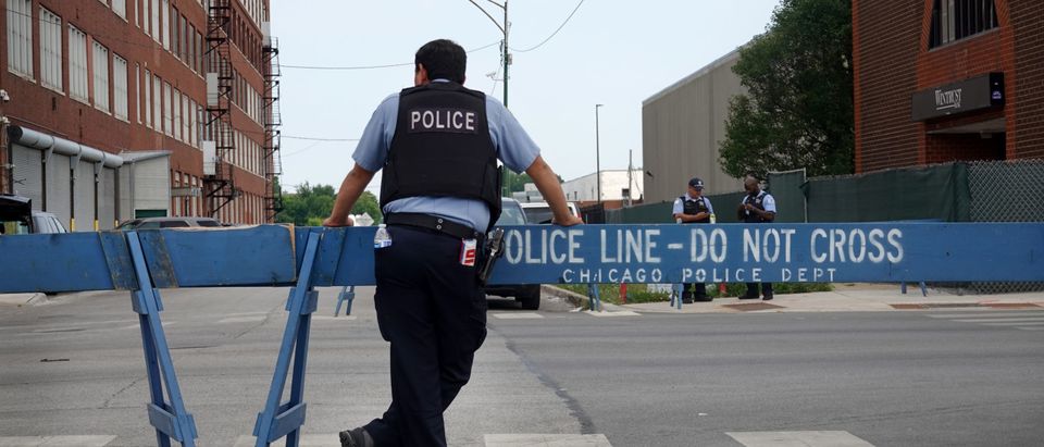 CHICAGO, ILLINOIS - AUGUST 15: Police stand guard as pro and anti-police demonstrators are expected to gather outside of the Homan Square police station on August 15, 2020 in Chicago, Illinois. The demonstration was one of several in the city today, either in support of or in opposition to police. (Scott Olson/Getty Images)