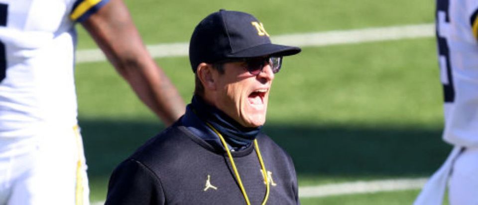 BLOOMINGTON, INDIANA - NOVEMBER 07: Head coach Jim Harbaugh of the Michigan Wolverines walks on the field calling out to his team during warm ups before the game against the Indiana Hoosiers at Memorial Stadium on November 07, 2020 in Bloomington, Indiana. (Photo by Justin Casterline/Getty Images)