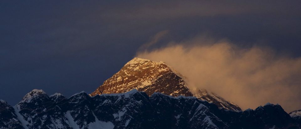 Light illuminates Mount Everest, during sunset in Solukhumbu District also known as the Everest region
