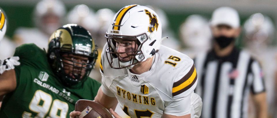 Nov 5, 2020; Fort Collins, CO, USA; Wyoming Cowboys quarterback Levi Williams (15) runs the ball against the Colorado State Rams in the third quarter at Canvas Stadium. Mandatory Credit: Bethany Baker-USA TODAY NETWORK via Reuters