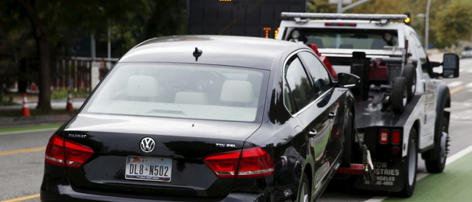 A diesel Volkswagen Passat TDI SEL is taken away by a tow truck for having an expired registration, in Santa Monica