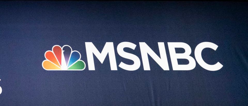 Advertising signage for NBC News and the Democratic Party is seen inside the media filing center at Adrienne Arsht Center for the Performing Arts where the first Democratic presidential primary debates for the 2020 elections will take place, June 25, 2019 in Miami, Florida. (Drew Angerer/Getty Images)