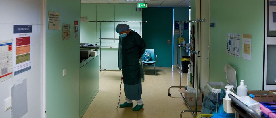 A healthcare worker puts on protective gear before tending to coronavirus patients at the Intensive Care Unit (ICU) of the University Hospital in Igualada on December 1, 2020. - Spain said today it is buying more than 50 million additional doses of Covid-19 vaccines from three different labs, bringing the total number it will acquire to 105 million. Spain has been badly hit by the pandemic, suffering nearly 1.6 million confirmed infections -- the European Union's second-highest number after France -- and more than 45,000 deaths, although that figure only counts those who formally tested positive for Covid-19. (Photo by Pau Barrena/AFP via Getty Images)