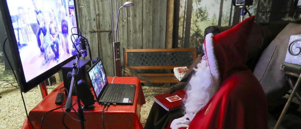 A person dressed as Samichlaus interacts with children via video in Zurich