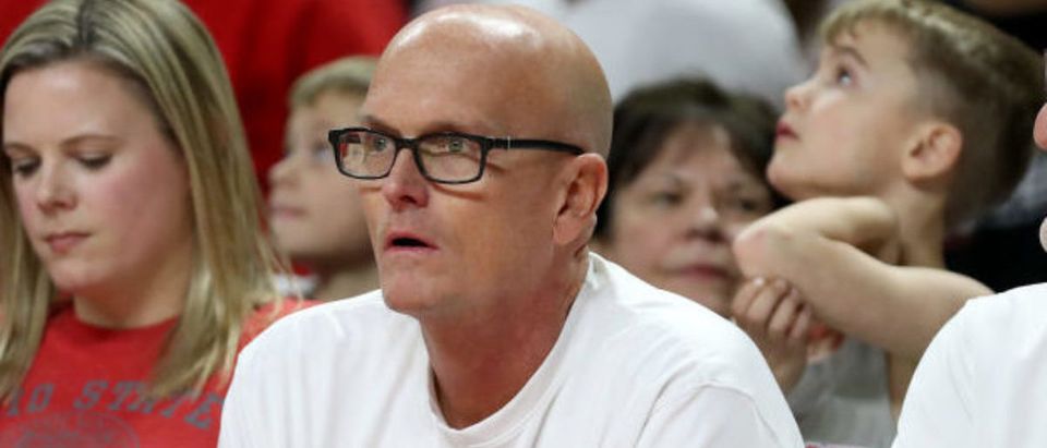 COLLEGE PARK, MARYLAND - JANUARY 07: Sportscaster Scott Van Pelt (C) watches during the second half of the Maryland Terrapins and Ohio State Buckeyes game at Xfinity Center on January 07, 2020 in College Park, Maryland. (Photo by Rob Carr/Getty Images)