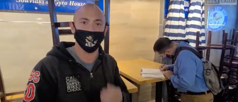 Anton Van Happen, owner of 'Nick The Greek' confronted public health inspectors for issuing him a citation for staying open (Screenshot/ Youtube Daily Caller)