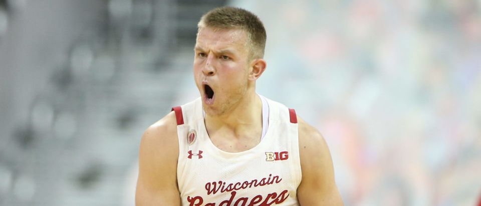 Dec 22, 2020; Madison, Wisconsin, USA; Wisconsin Badgers guard Brad Davison (34) celebrates a three-point basket during the game with the Nebraska Cornhuskers in the second half at the Kohl Center. Mandatory Credit: Mary Langenfeld-USA TODAY Sports via Reuters