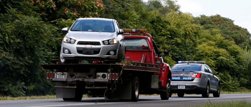 The car of suspected gunman Flanagan is towed away in Fauquier County, Virginia