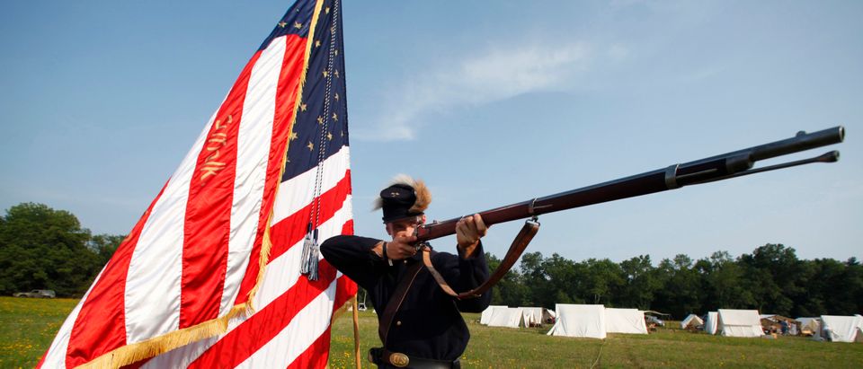 A Civil War reenactor poses with his musket on the eve of the anniversary of the First Battle of Bull Run in Manassas