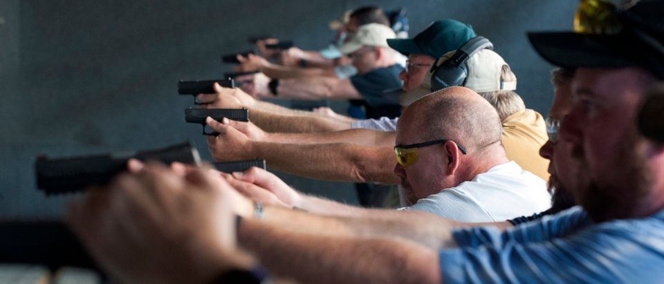 School teachers and administrators fire their guns during the FASTER Level 2 two day firearms course at Flatrock Training Center in Commerce City, Colorado on August 10, 2019. - FASTER Colorado has been sponsoring firearms training to Colorado teachers and administrators since 2017. Over 200 Colorado teachers and administrators have participated in the course. Colorado is one of approximately 30 states that allow firearms within school limits, and an estimated 34 school districts in Colorado allow teachers and administrators to carry concealed firearms. (JASON CONNOLLY/AFP via Getty Images)
