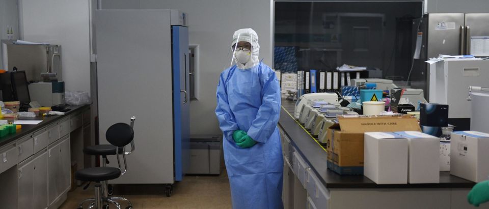 This photo taken on April 10, 2020 shows a technician in a sample mixing lab at CapitalBio Technology, a Beijing-based company which makes medical test kits, in Beijing. (GREG BAKER/AFP via Getty Images)