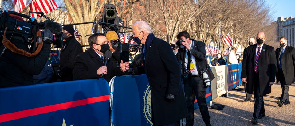 President Joe Biden talks with NBC Reporter Mike Memoli as he and and First Lady Dr. Jill Biden walk along Pennsylvania Avenue in front of the White House during Inaugural celebrations on January 20, 2021 in Washington, DC. (Doug Mills-Pool/Getty Images)
