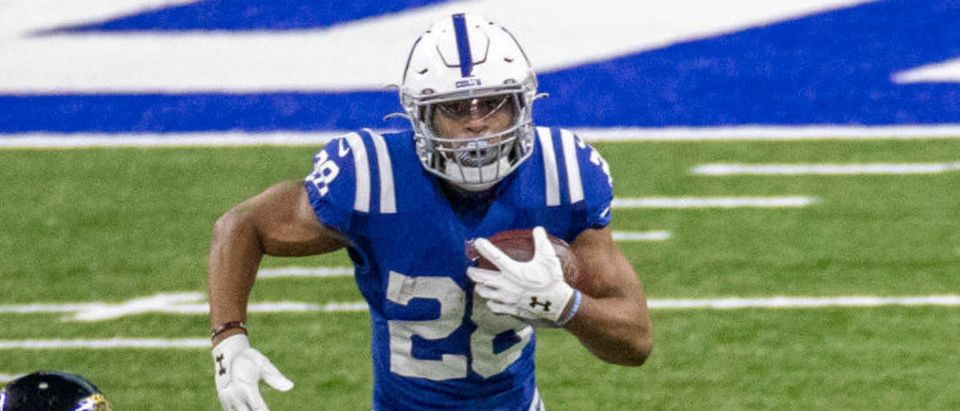 INDIANAPOLIS, IN - JANUARY 03: Jonathan Taylor #28 of the Indianapolis Colts runs with the ball during the first quarter of the game against the Jacksonville Jaguars at Lucas Oil Stadium on January 3, 2021 in Indianapolis, Indiana. (Photo by Bobby Ellis/Getty Images)
