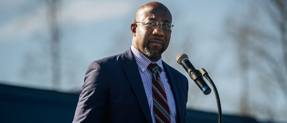 RIVERDALE, GA - JANUARY 04: Georgia Democratic Senate candidate Rev. Raphael Warnock speaks at a drive-in rally on January 4, 2021 in Riverdale, Georgia. In the lead-up to the January 5 runoff election, Democratic Senate candidate Rev. Raphael Warnock continues to focus on voting efforts across the state of Georgia. (Photo by Brandon Bell/Getty Images)