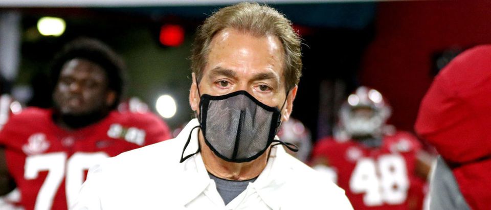 Jan 11, 2021; Miami Gardens, Florida, USA; Alabama Crimson Tide head coach Nick Saban leads his team onto the field before playing then Ohio State Buckeyes in the 2021 College Football Playoff National Championship Game. Mandatory Credit: Mark J. Rebilas-USA TODAY Sports via Reuters