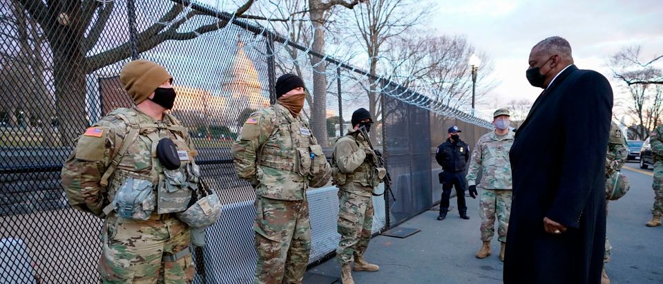Secretary of Defense Lloyd Austin (L) visits National Guard troops deployed at the US Capitol and its perimeter, on January 29, 2021 on Capitol Hill in Washington, DC. (Photo by Manuel Balce Ceneta/AFP via Getty Images)