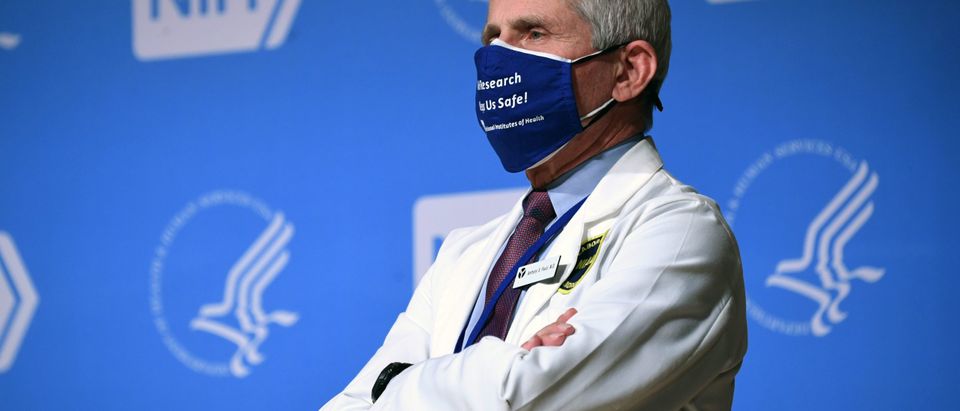 White House Chief Medical Adviser on Covid-19 Dr. Anthony Fauci listens to US President Joe Biden (out of frame) speak during a visit to the National Institutes of Health (NIH) in Bethesda, Maryland, February 11, 2021. (Photo by SAUL LOEB/AFP via Getty Images)